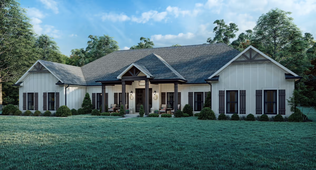 Single-story senior care facility front with manicured lawn and surrounding trees.