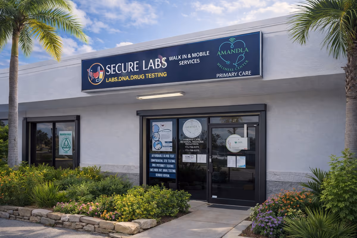 Exterior of Secure Labs facility with signage, glass doors, and tropical landscaping.