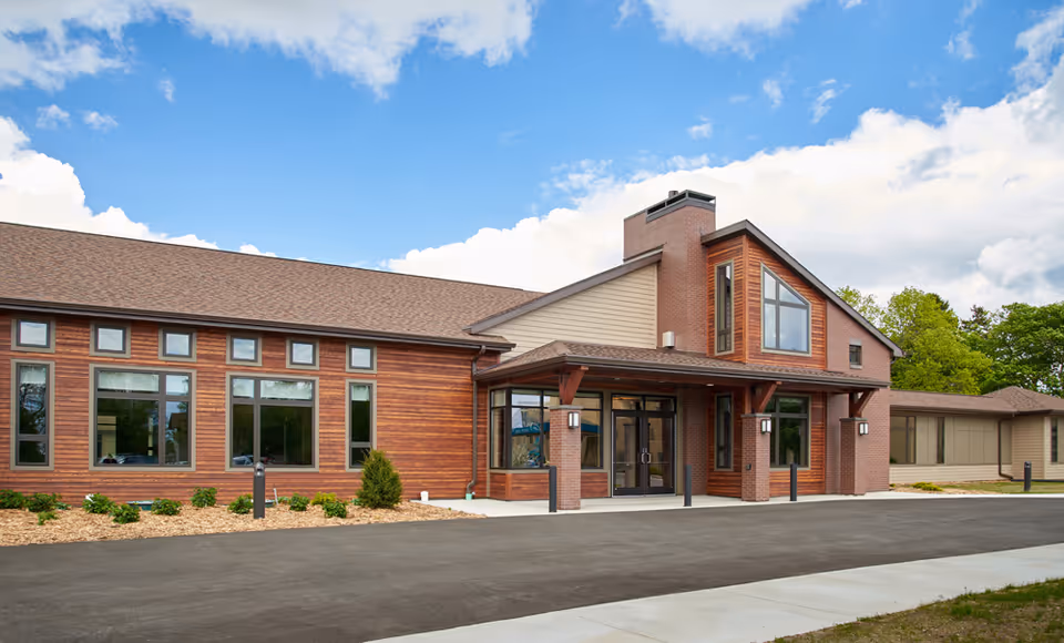 Shady Lane senior living facility front entrance with brick exterior and glass doors.