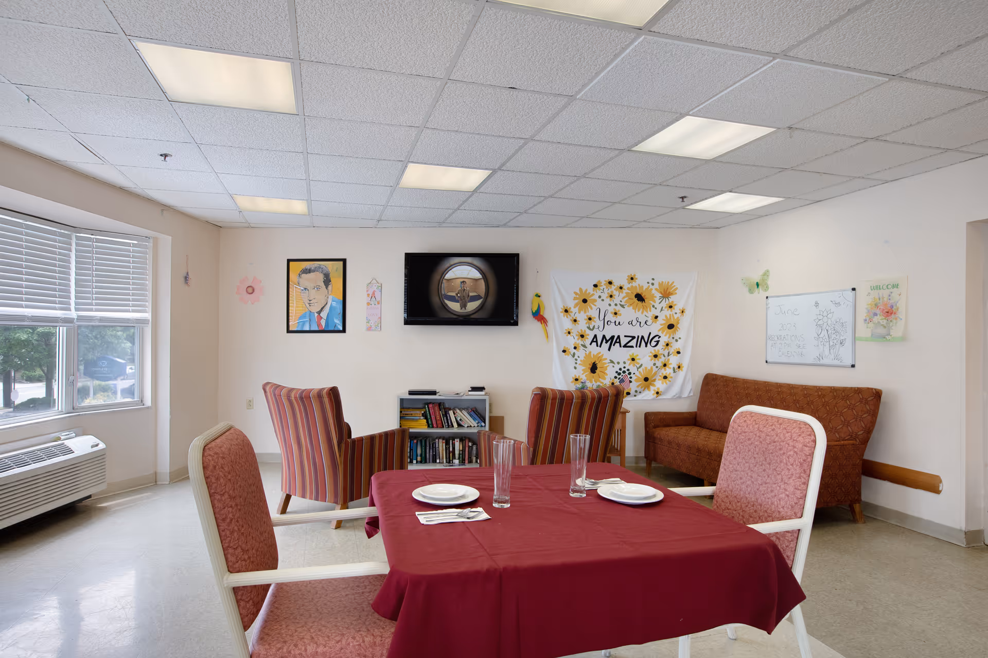 Dining area with a table set for a meal and lounge seating.