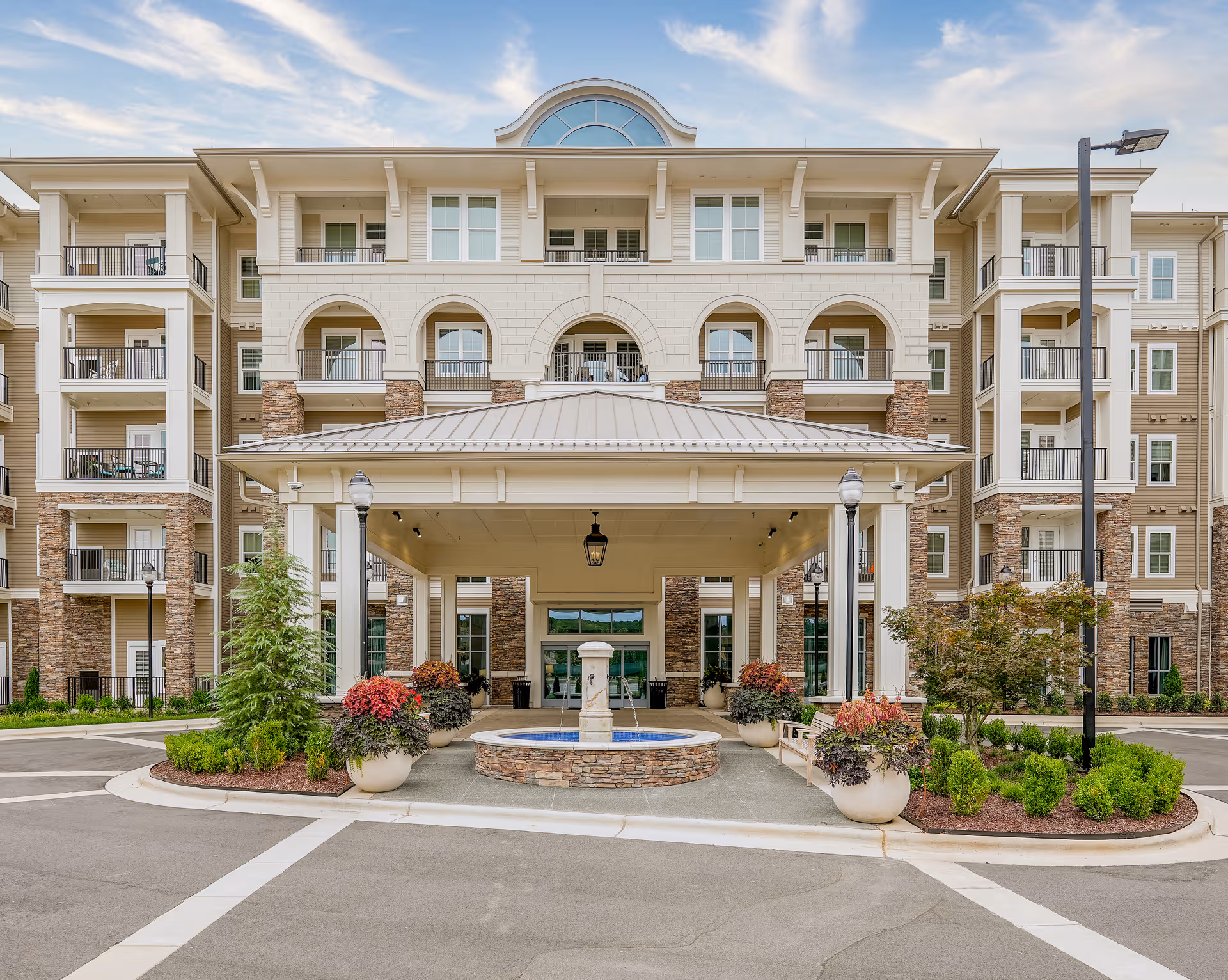 Front view of The Cambridge at Brier Creek, a multi-story senior living facility entrance.