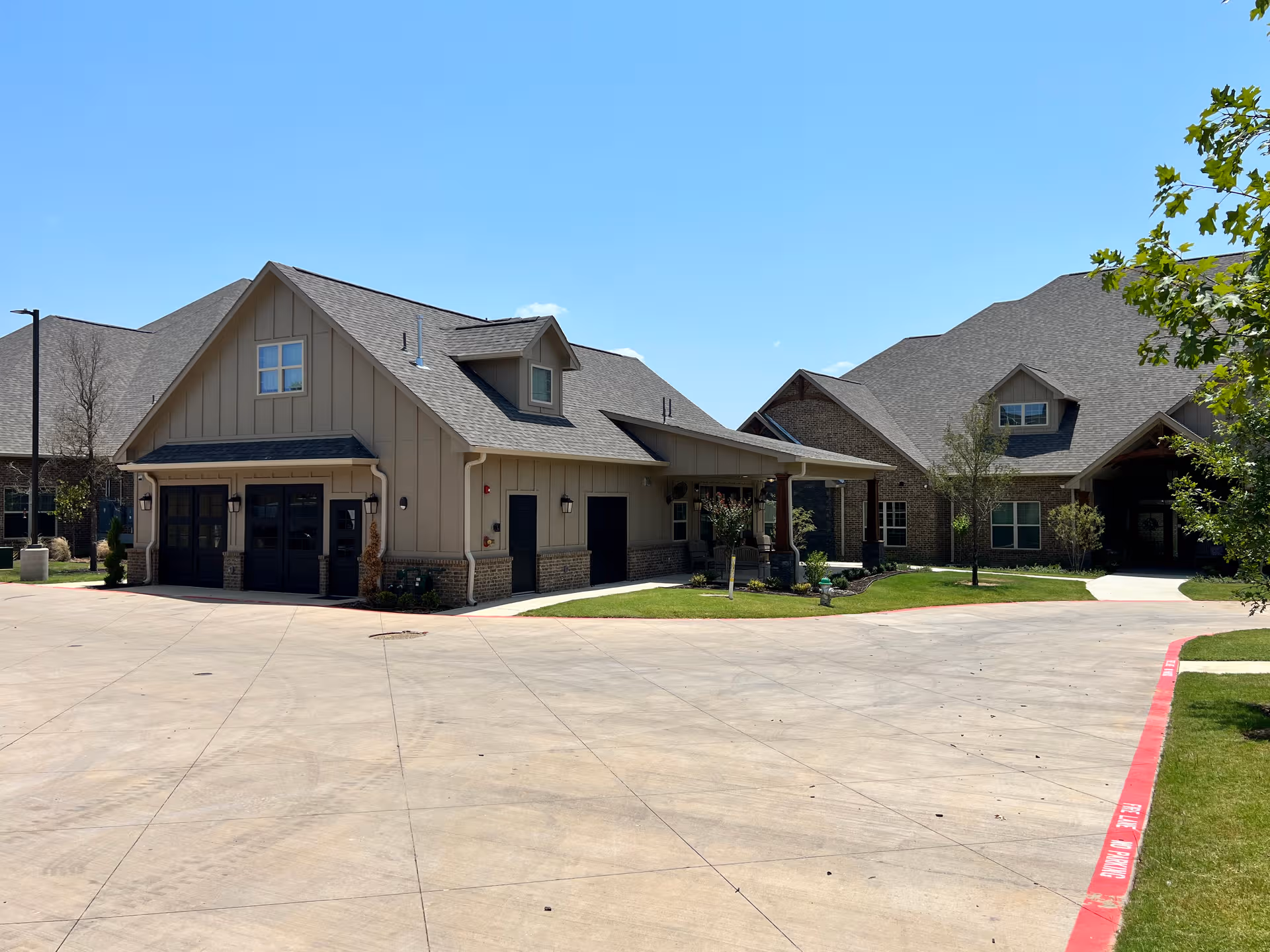 Exterior view of Teresa's House Assisted Living & Memory Care building cluster on a sunny day.