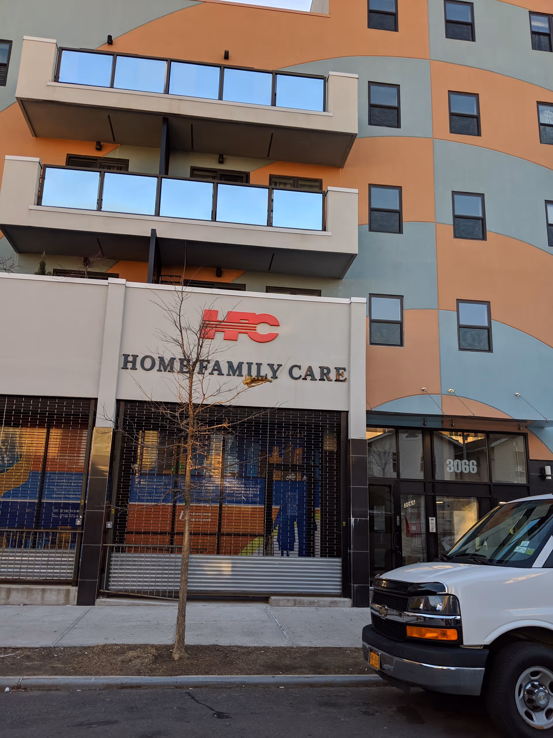 Colorful building front labeled Home Family Care with a storefront and a parked van.