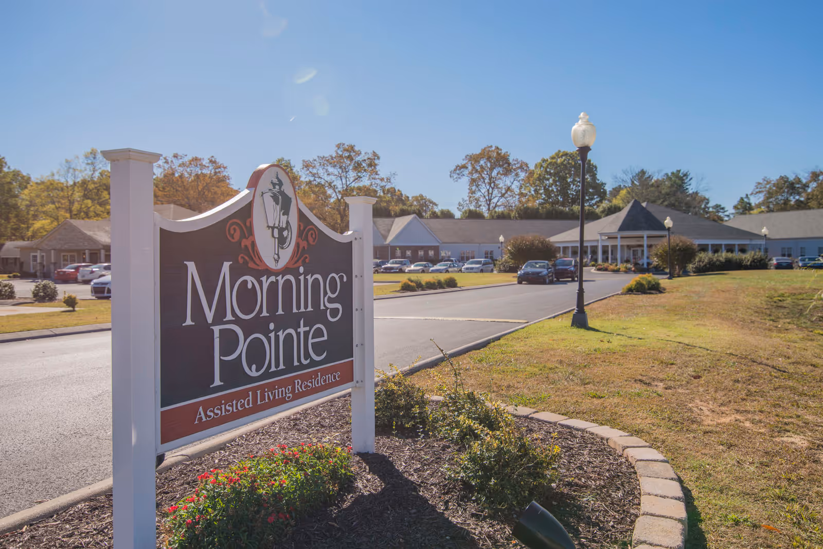 Morning Pointe sign and front entrance of a senior living facility with parking.