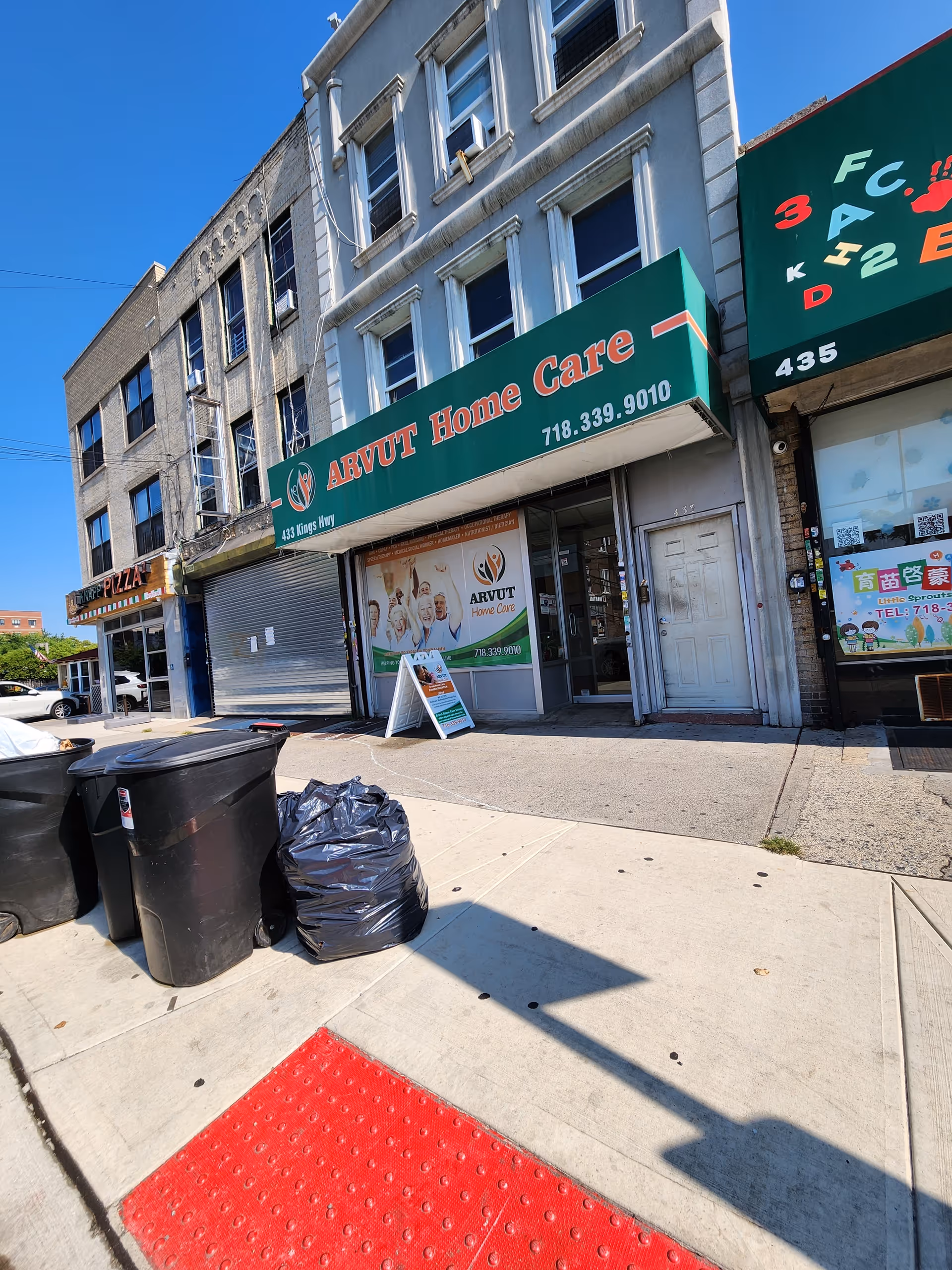Street-level view of ARVUT Home Care storefront with signage and surrounding buildings.
