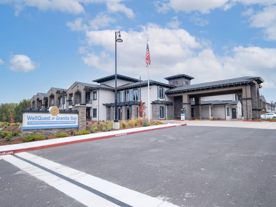 Front exterior of WellQuest of Granite Bay with sign, flagpole, and parking lot.