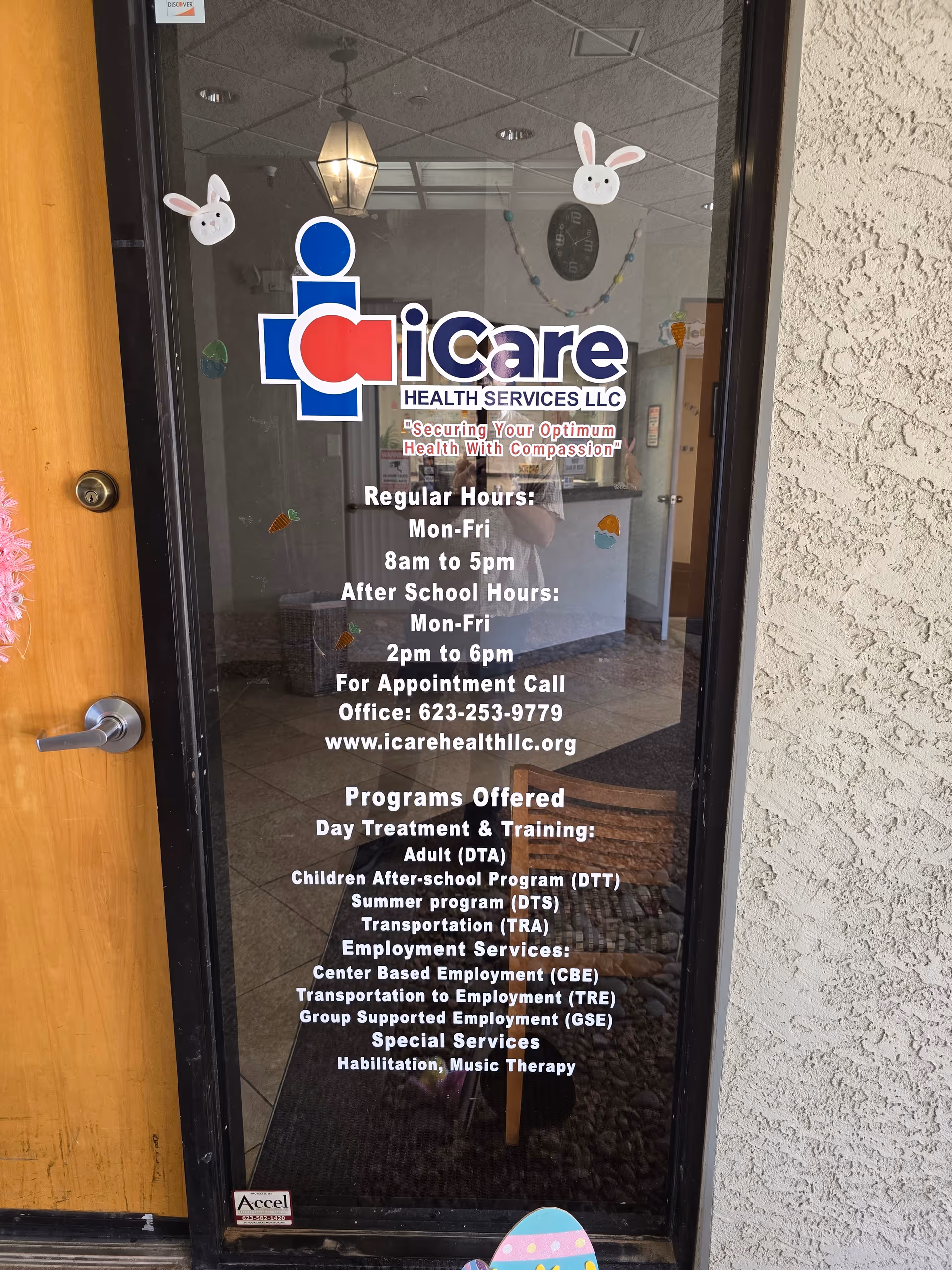 Glass door entrance for iCare Health Services LLC Olive Ave with hours