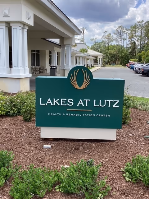 Exterior view of Lakes at Lutz Health & Rehabilitation sign outside the building.