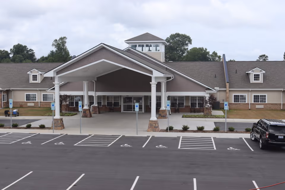 Front view of Grace Village Assisted Living entrance with handicap parking.