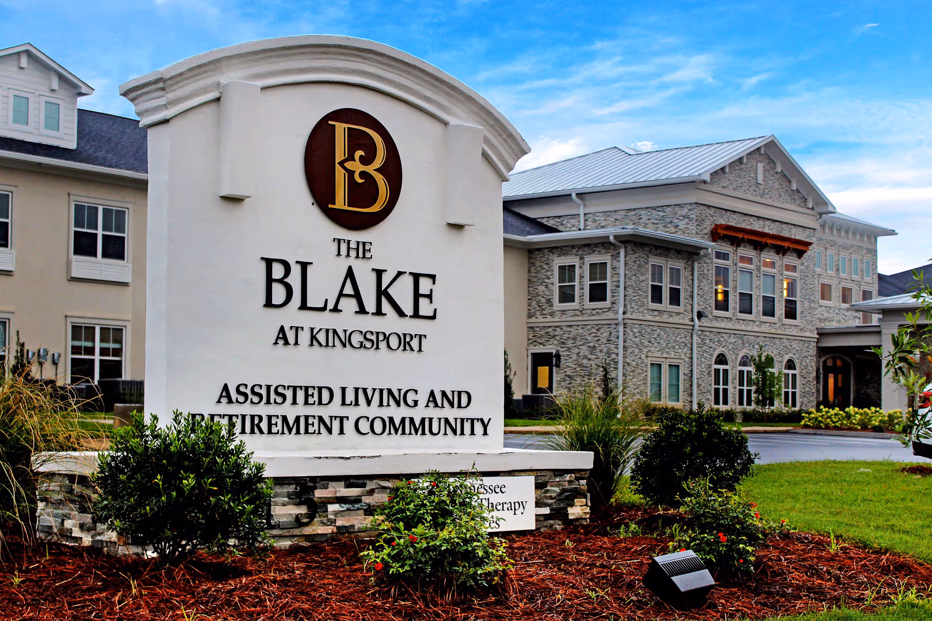 The Blake at Kingsport sign in front of a stone-clad building exterior.
