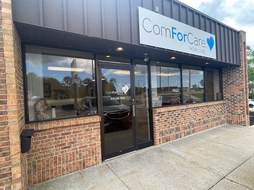 Brick storefront with glass entrance and ComForCare Home Care sign on the front