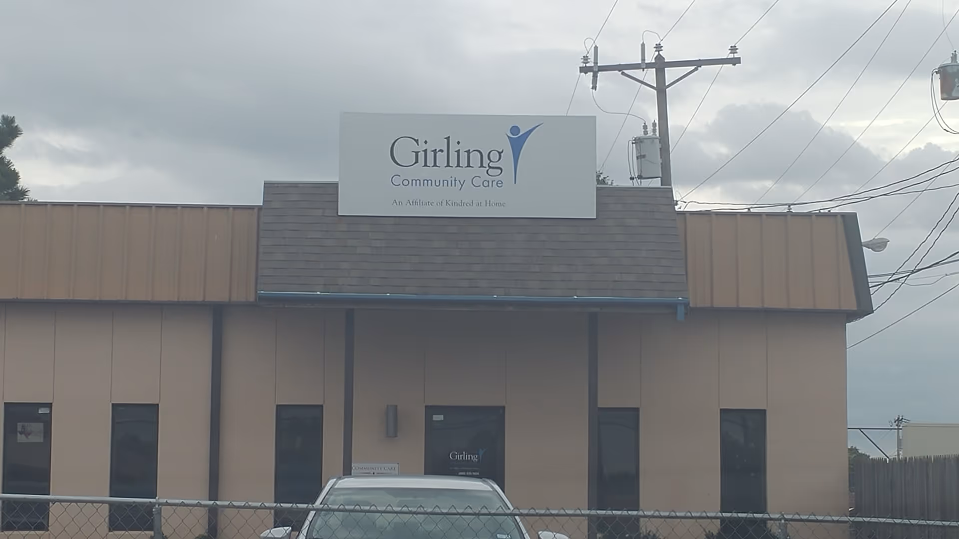 Exterior view of Girling Community Care building with a sign above the entrance.