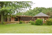 Aperion Care Wilmington building exterior with gazebo and green lawn.