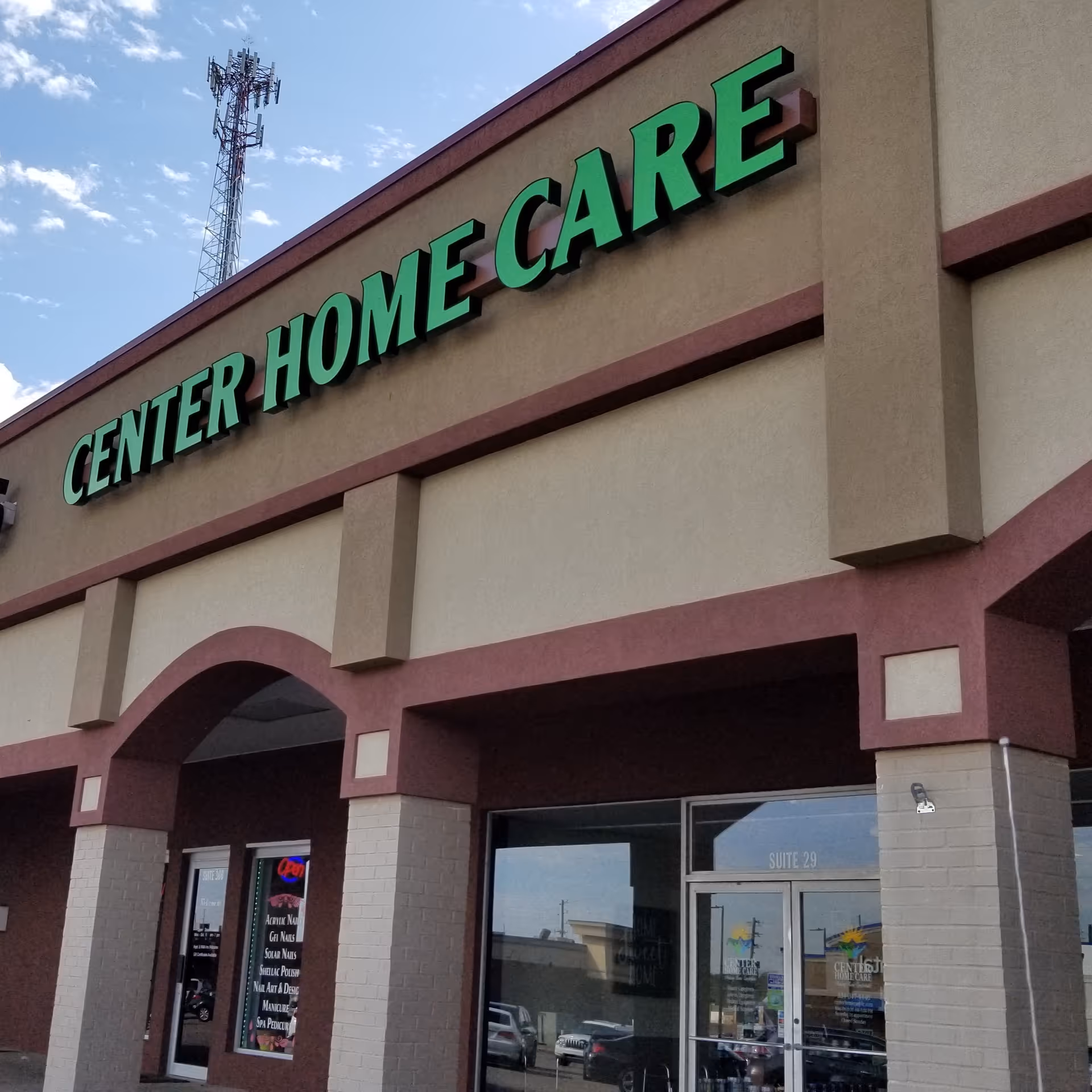 Exterior view of Center Home Care facility with large green sign