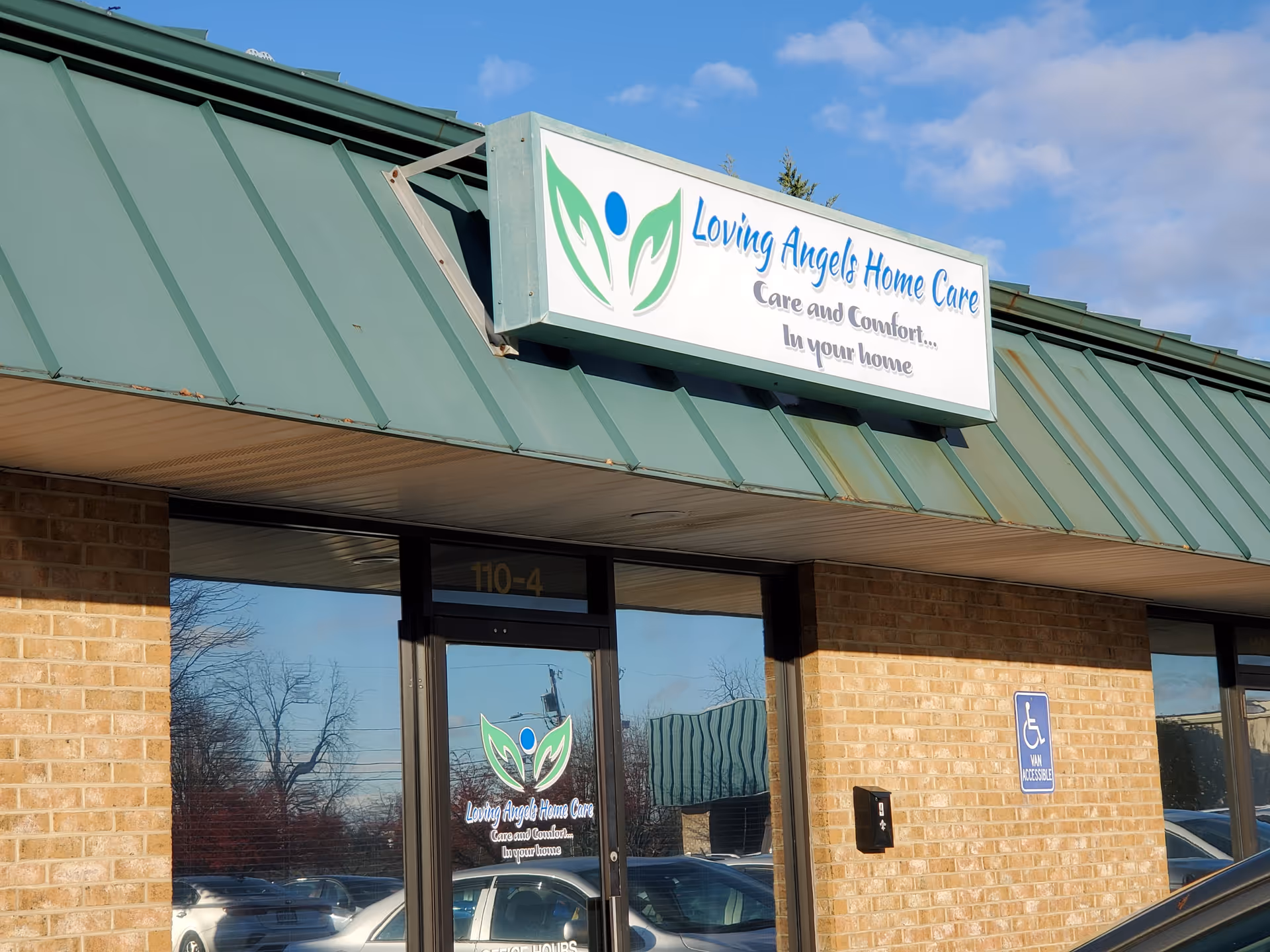 Exterior view of a brick building with the Loving Angels Home Care sign above the entrance.