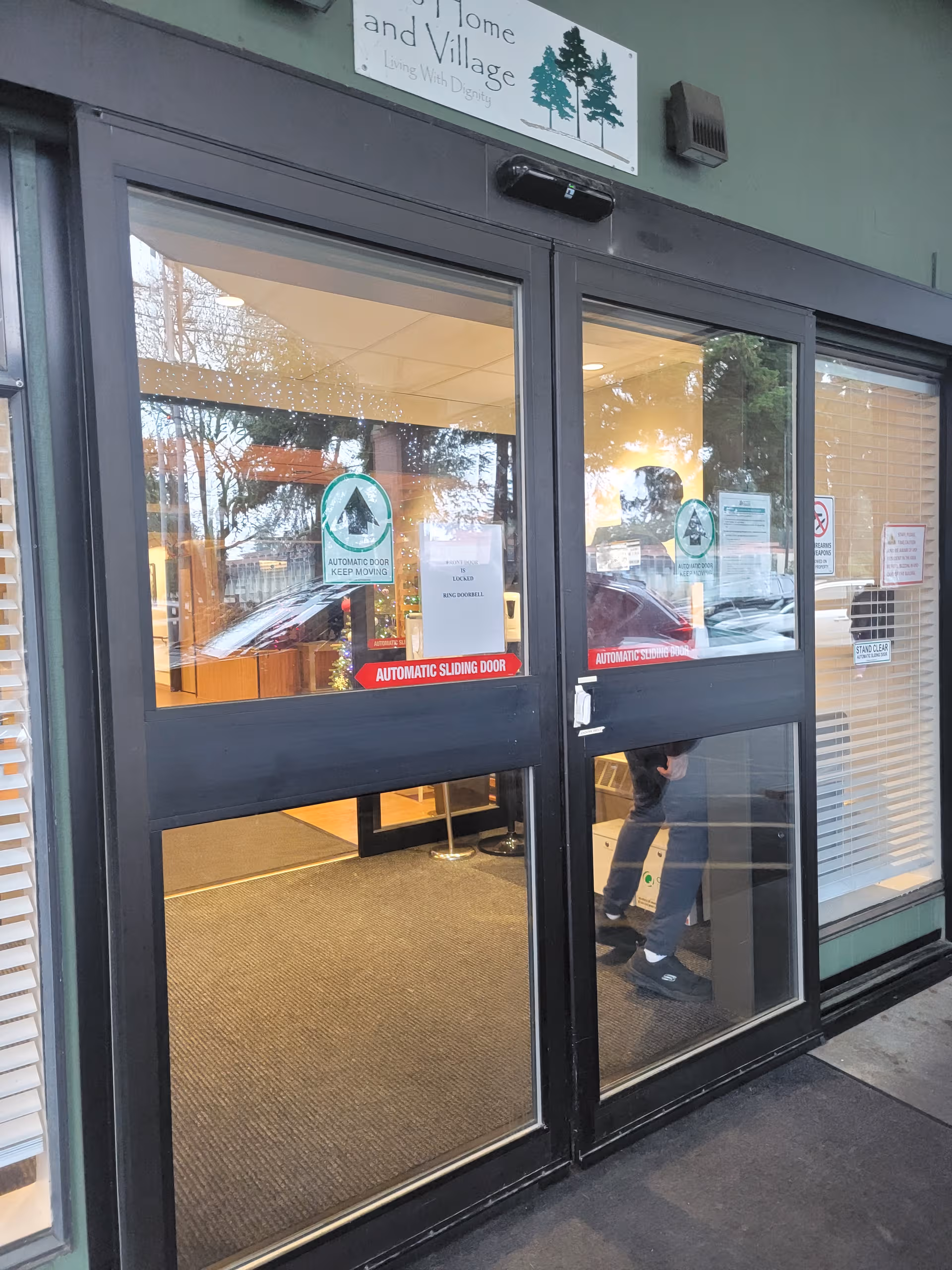 Glass entrance doors to The Broadview Center with automatic sliding doors and visible lobby.