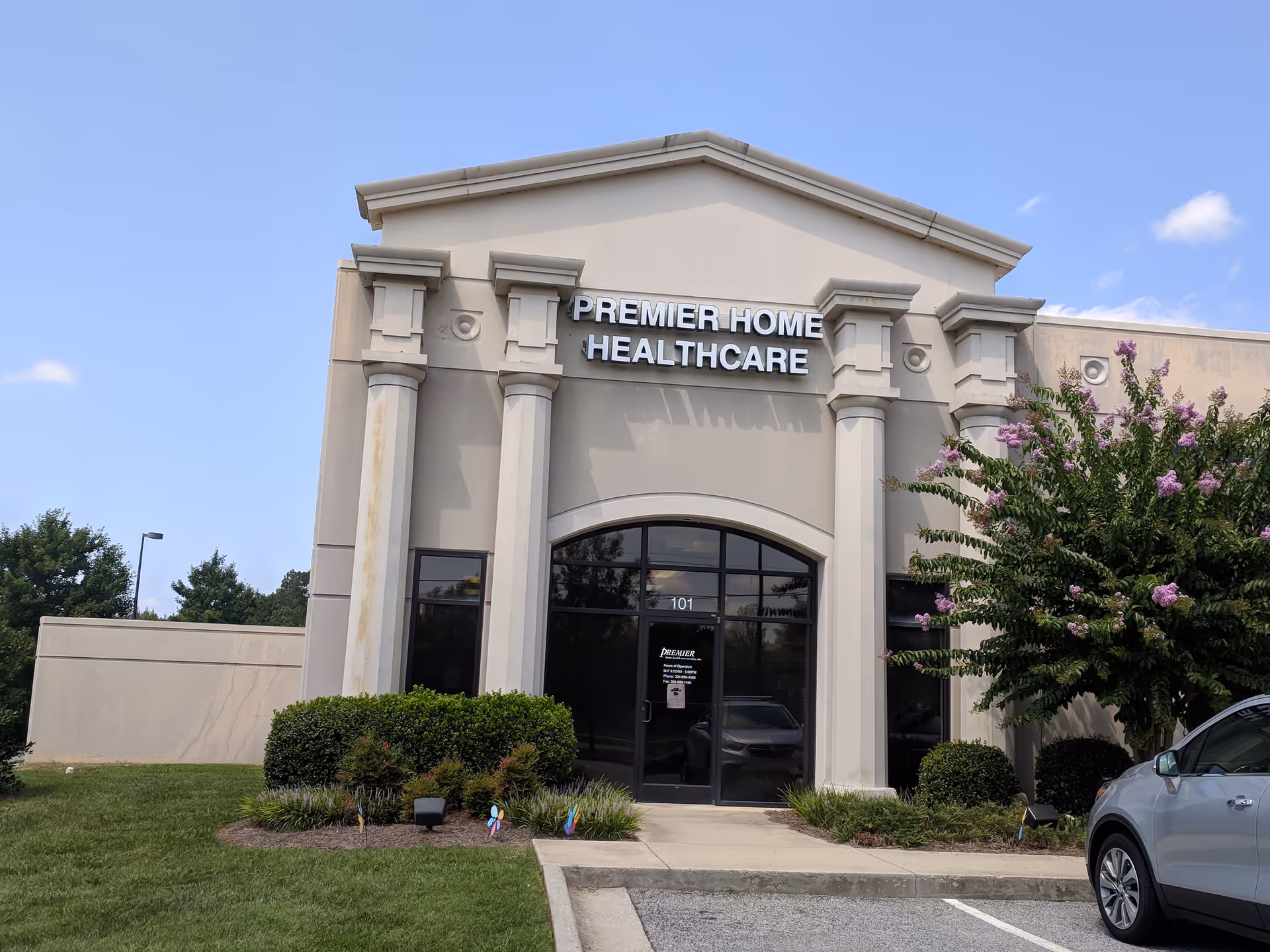 Front view of Premier Home Healthcare entrance with columns and landscaping.