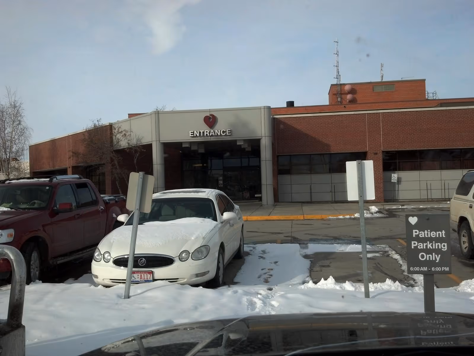 Exterior view of Sheridan Memorial Hospital entrance with snow-covered parking.