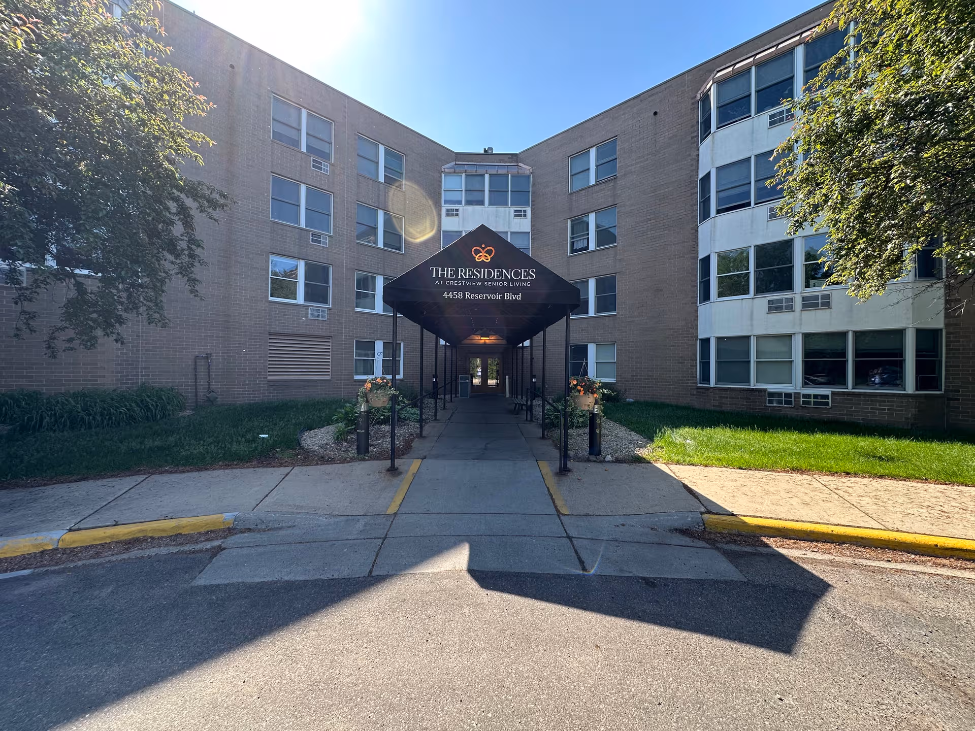 Front entrance of Crest View senior living building with a covered walkway.