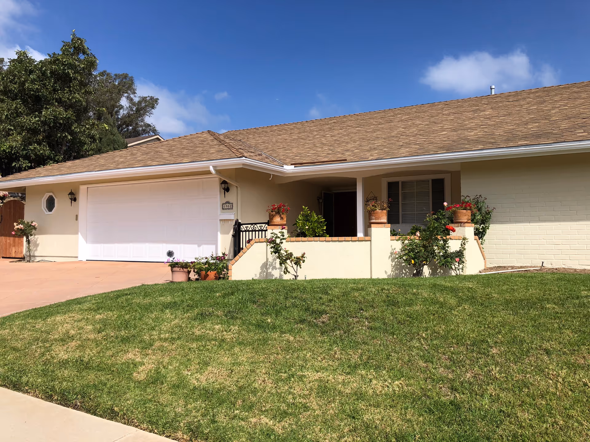 Grace Dairo Care Home exterior: single-story facade with garage, front yard, and potted plants.