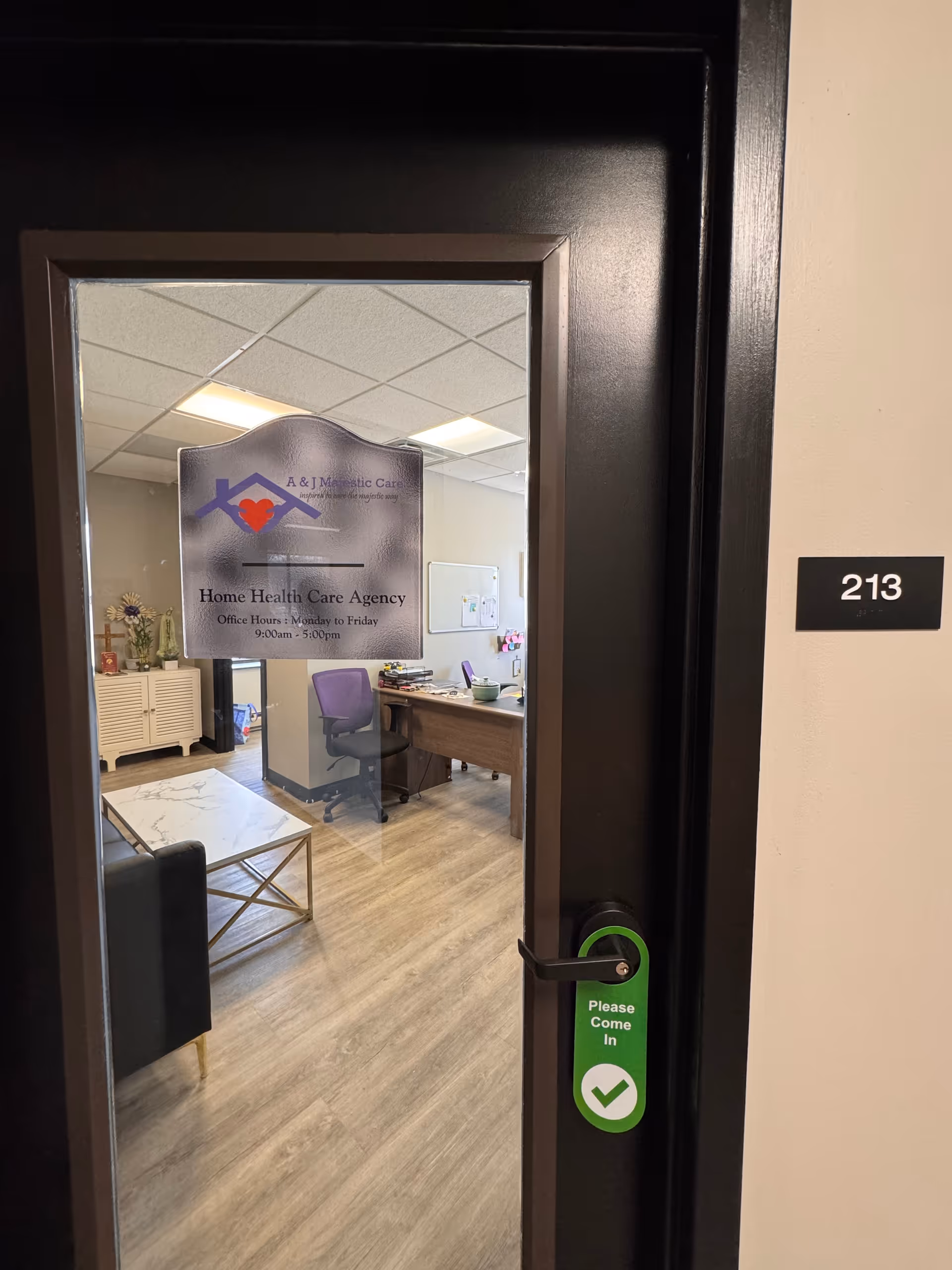 Interior lobby with desk, seating area, and a sign reading Home Health Care Agency.