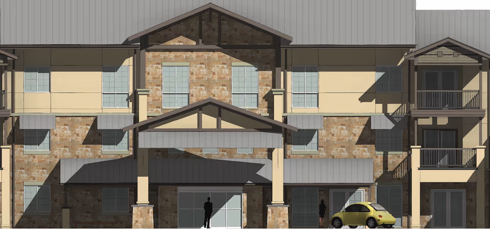 Exterior view of a Lake Travis Independent Living facility with entrance canopy.