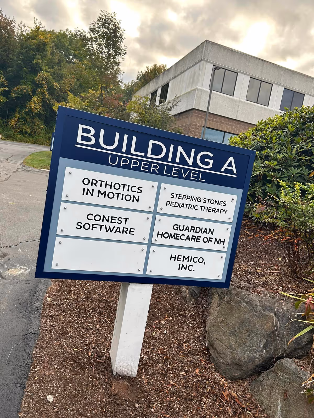 Outdoor building sign for Building A upper level with tenants including Guardian Homecare of NH.