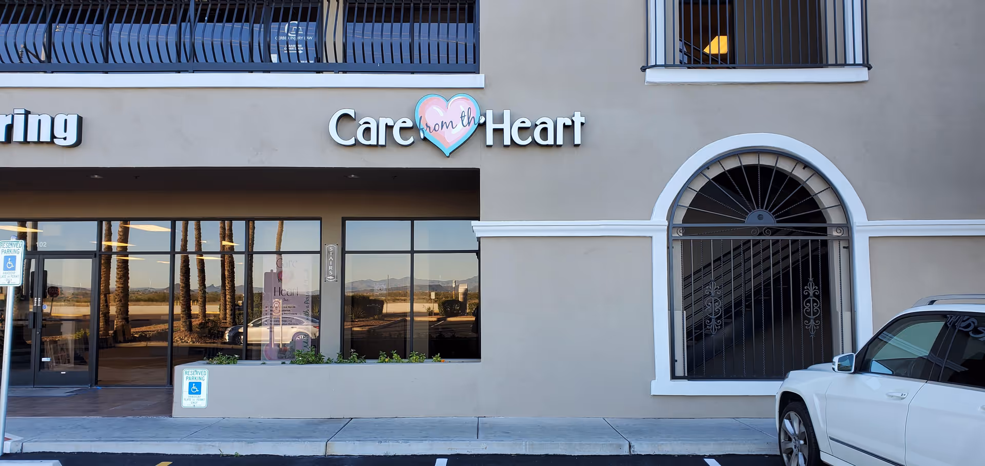 Exterior view of Care from the Heart facility storefront with arched entrance.