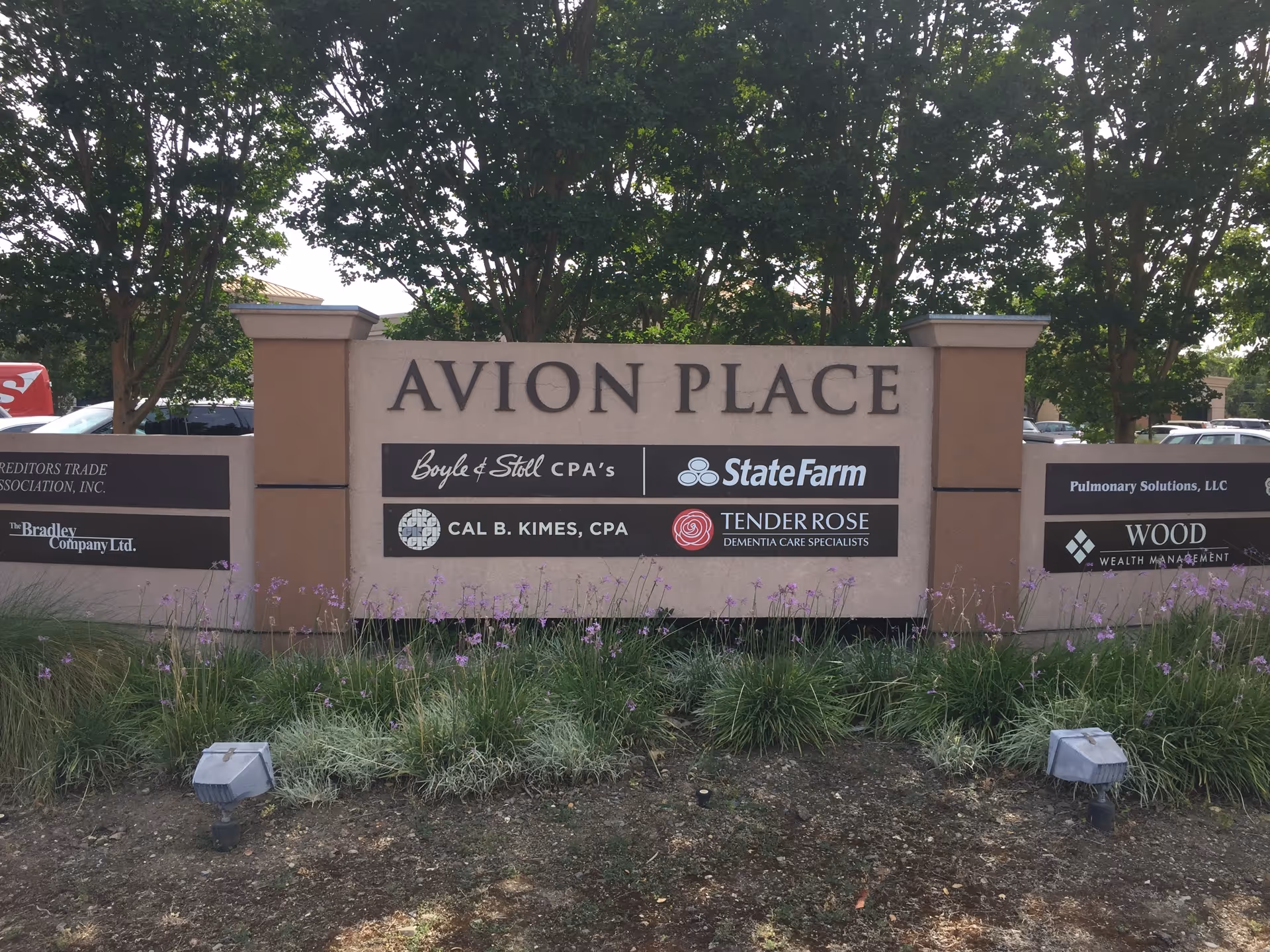 Entrance sign for Avion Place featuring Tender Rose Dementia Care Specialists sponsorship.