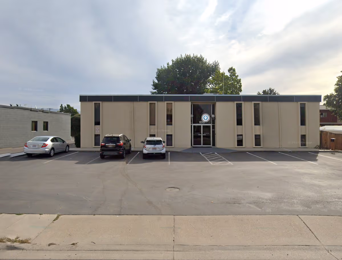 Exterior view of Premier Home Care building with a parking lot in front.