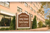 Exterior of a brick building with a welcoming Long Island Care Center sign.