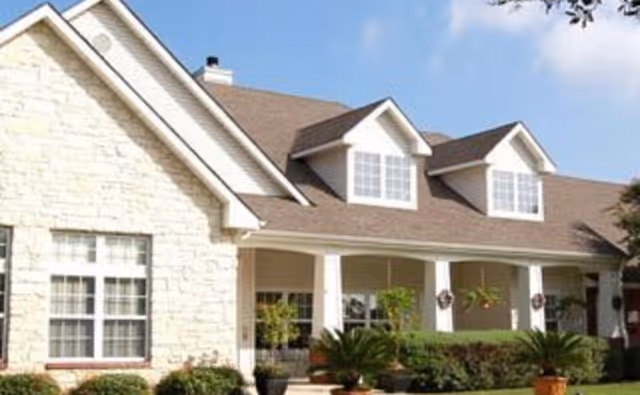Front exterior of Brookdale North Augusta senior living facility with entry porch and landscaping.