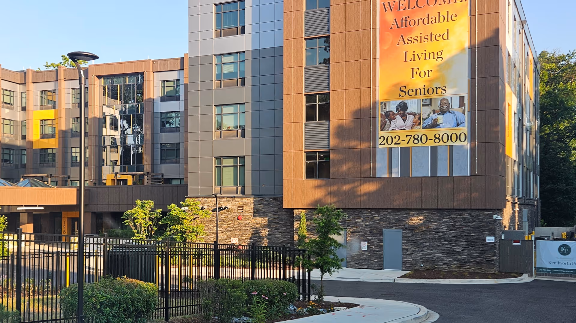 Exterior view of The Residences at Kenilworth Park with a large banner