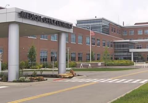 Front view of a brick medical building with a Medical Office Entrance sign.