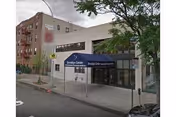 Exterior view of Brooklyn Center For Rehab And Residential Health Care building with blue awning.