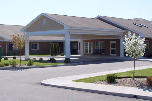 Exterior view of Hampton Oaks Health Campus entrance with a covered porte-cochere and landscaping.