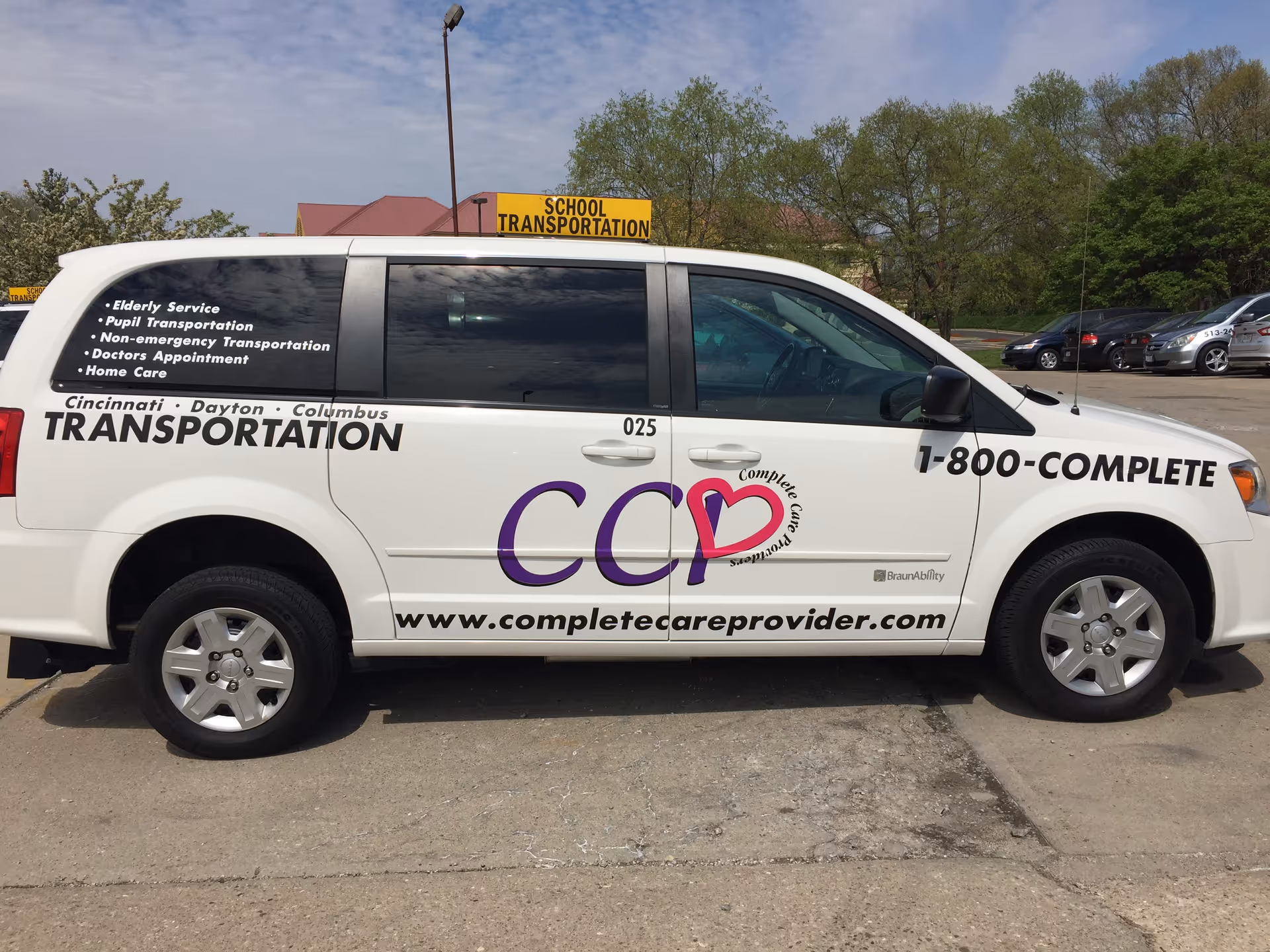 White van labeled Complete Care Providers with transportation listings parked in a lot