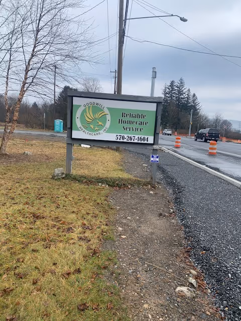 Outdoor roadside sign advertising Goodwill Healthcare, Inc. at facility entrance.