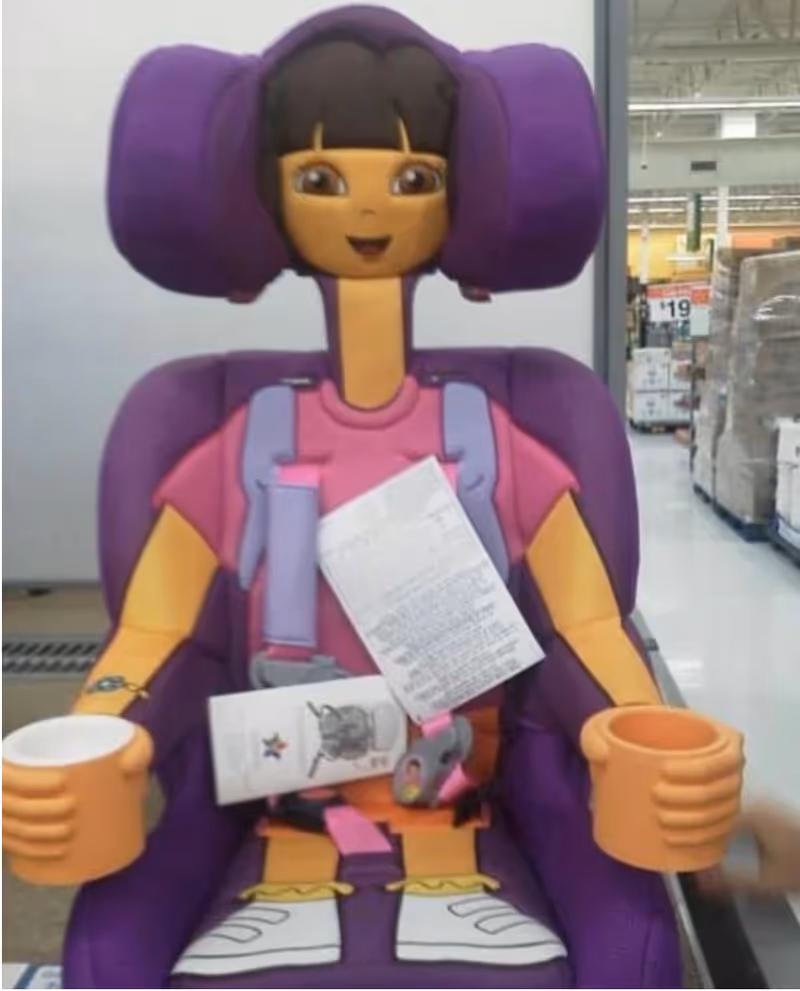Purple cartoon-style chair display in a store aisle with scattered papers.