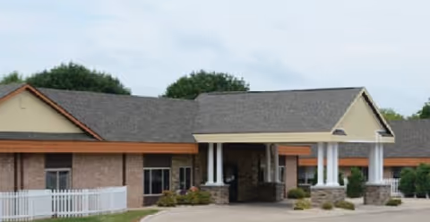 Exterior view of Eden Vista Ripon facility with a covered entrance and columns.