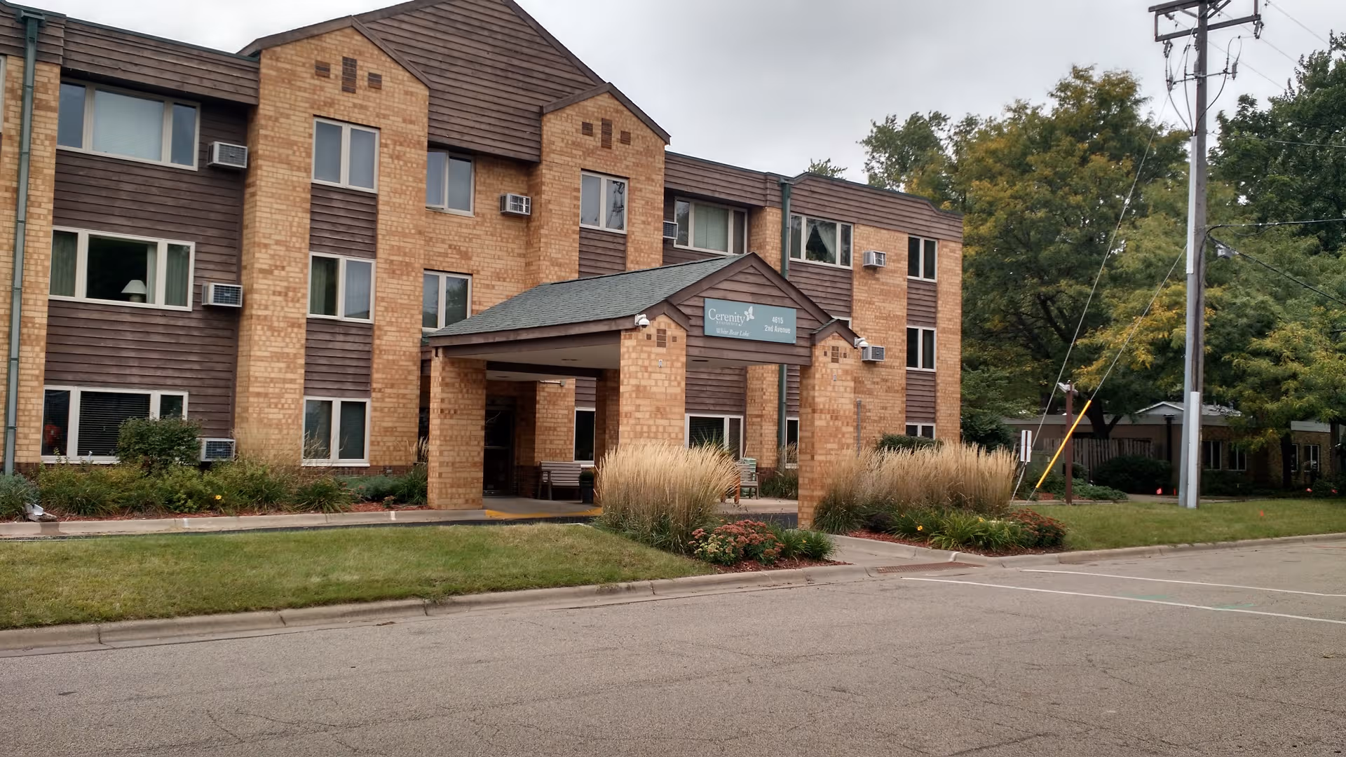 Cerenity Residence White Bear Lake exterior building with entrance canopy.