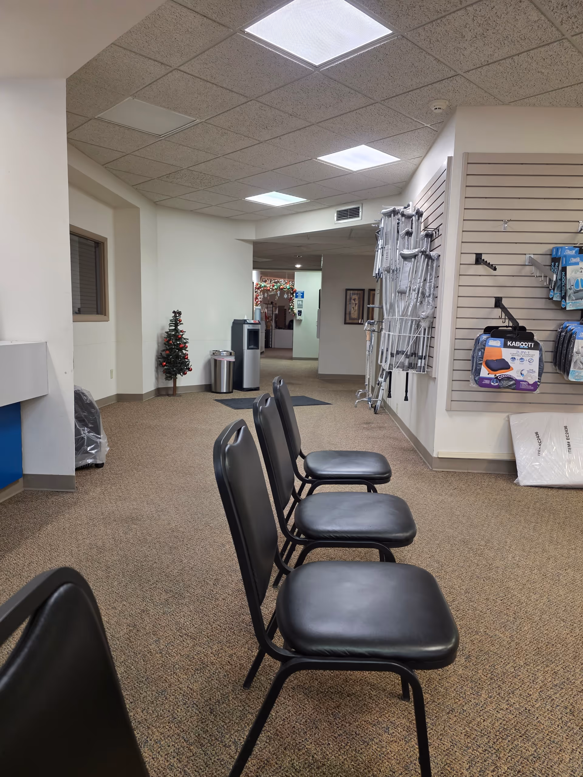 Empty waiting area with black chairs inside Ascension Via Christi Home Medical on Washington.