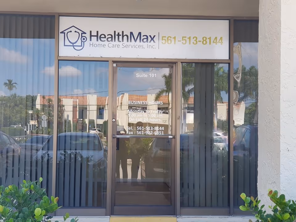 Front of HealthMax Home Care Services, Inc. building with sign and glass entrance
