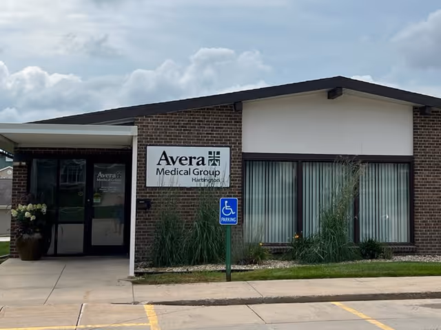 Exterior view of Avera Medical Group Hartington building with handicap parking sign
