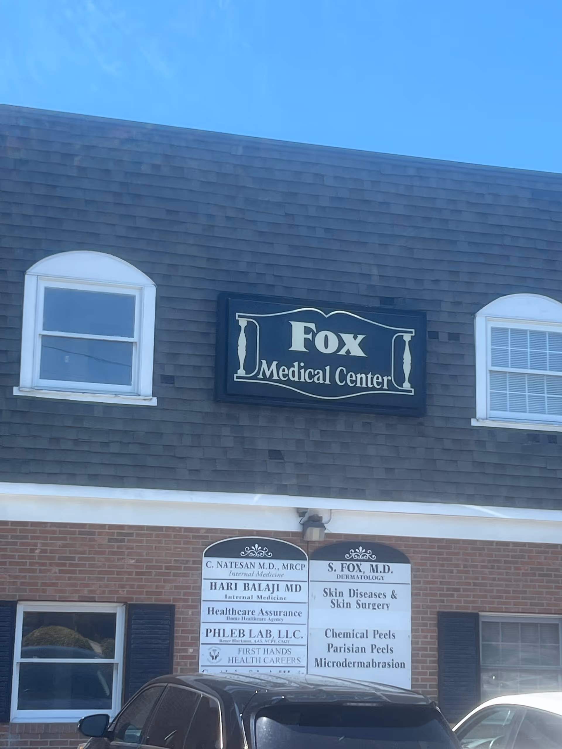 Exterior of a medical building with a Fox Medical Center sign and directory plaques.