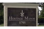 Entrance sign for Heritage Manor of Houma displaying 1701