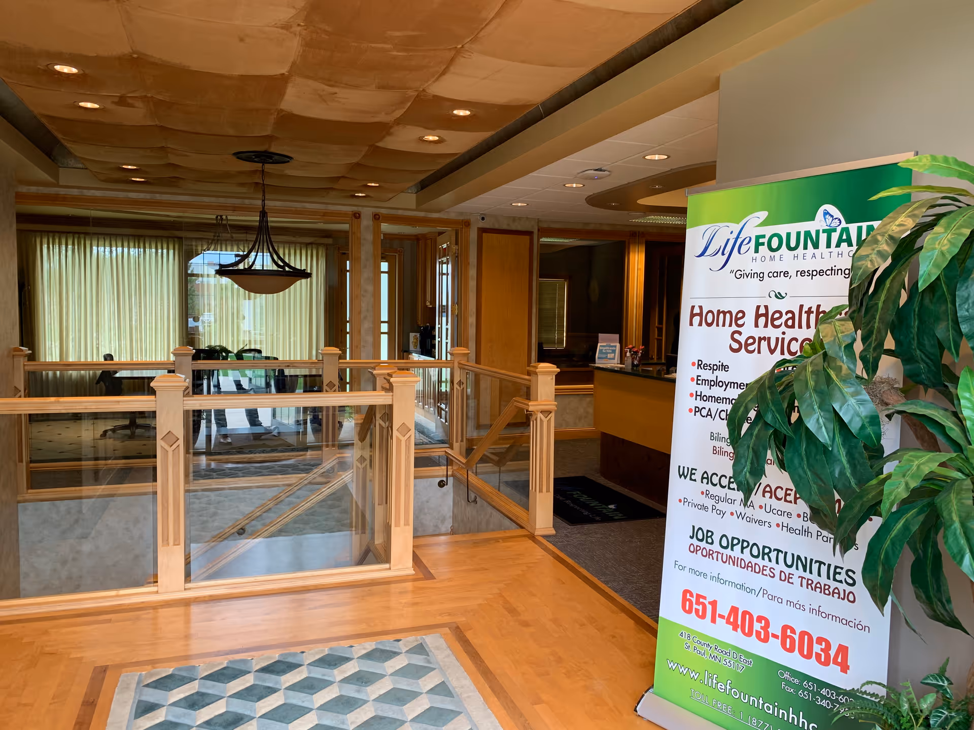 Interior lobby of Life Fountain Home Health Care with a banner near the reception desk.