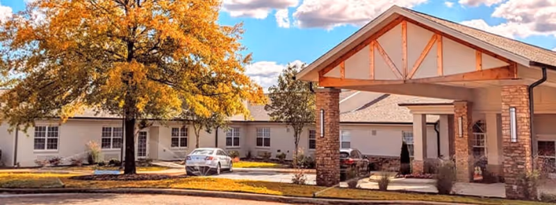 Exterior view of The Ridge at Grandeview, a senior living facility with a covered entrance.