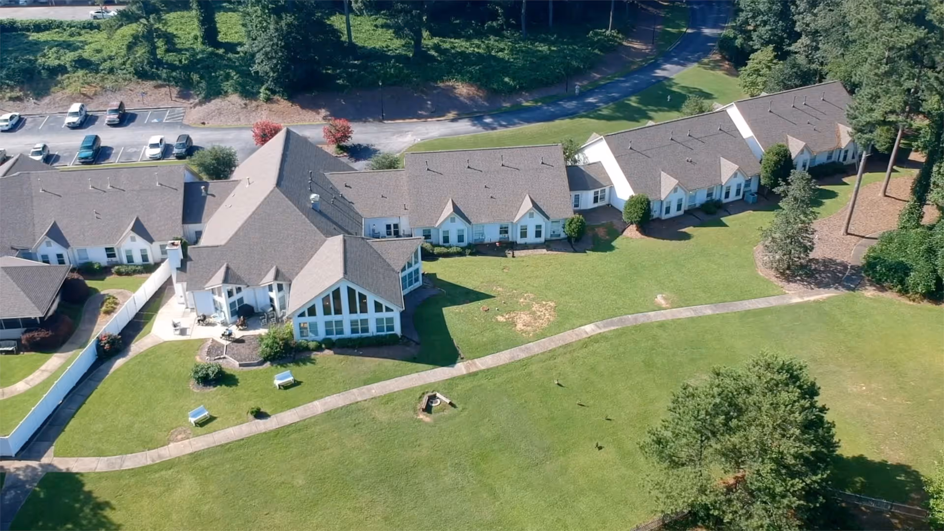 Aerial view of Goldencrest at Morrow Memory Care campus with green lawns and buildings.