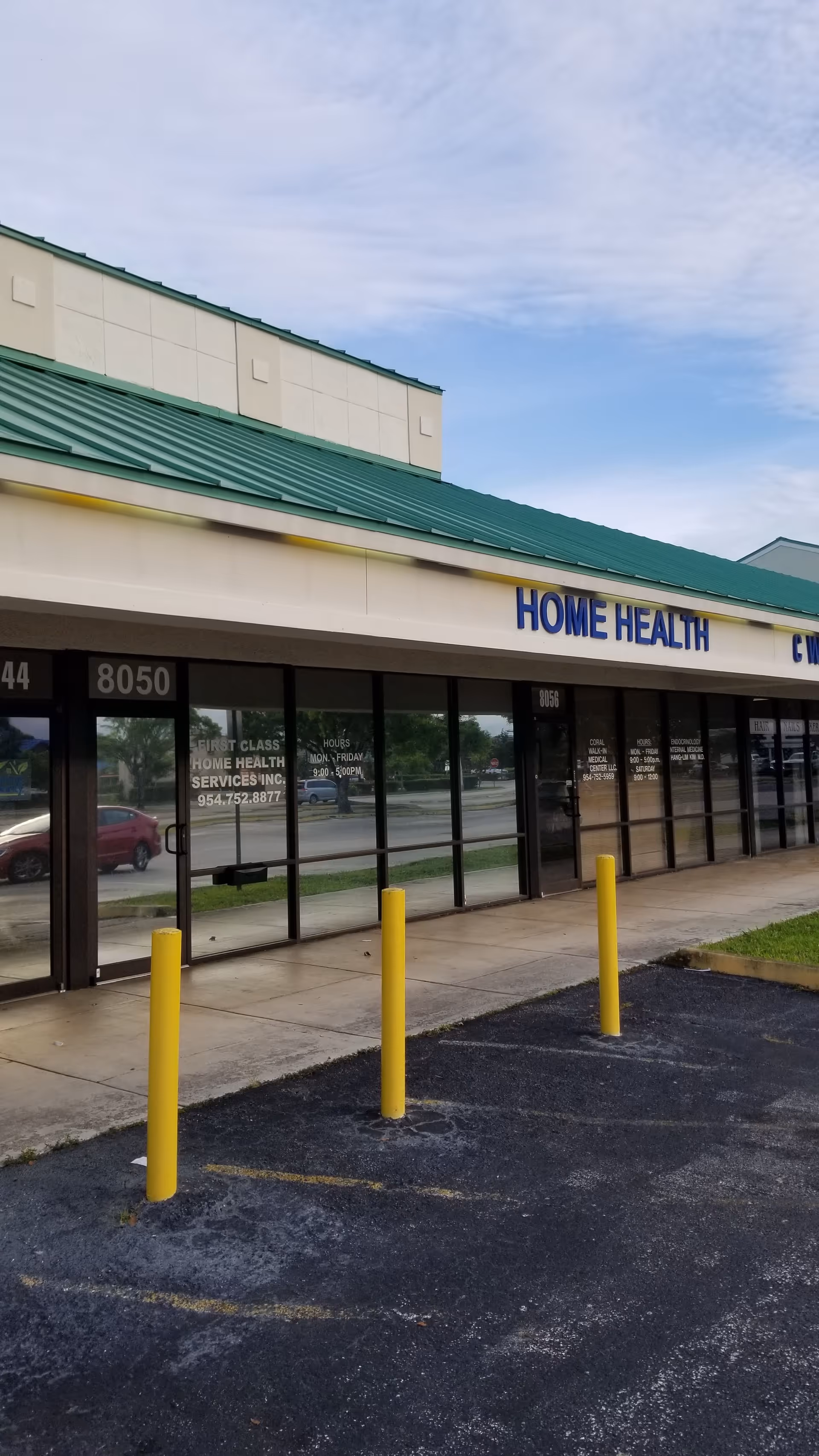 Exterior storefront with 'HOME HEALTH' signage and yellow bollards.